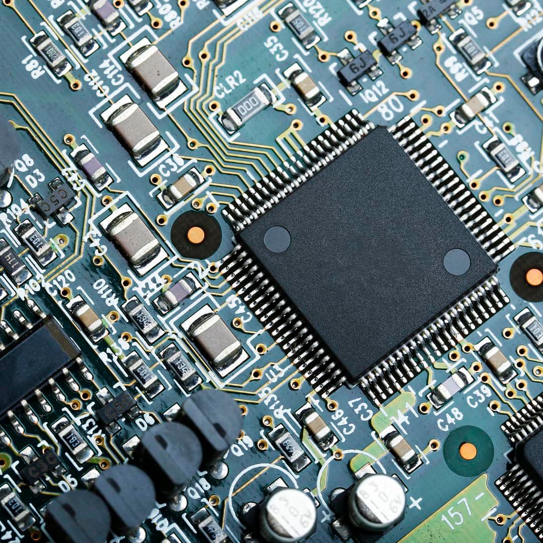 Closeup of electronic circuit board with cpu microchip electronic components background